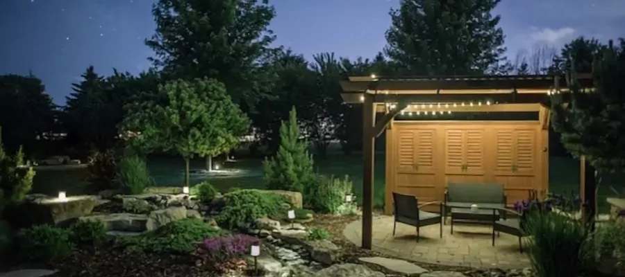 backyard with landscape lighting throughout
